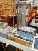 A large quantity of DVD's and CD's with CD player and rack