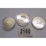 A 2004 silver £2 coin and 2 Bailwick of Guernsey £5 coins, 1999 and 2000.