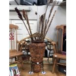 A bamboo walking stick stand with bamboo items