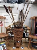 A bamboo walking stick stand with bamboo items