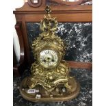 An ornate French style mantle clock