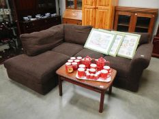 A brown fabric corner suite settee