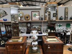 A pair of ornate gilded/mirrored torchiere stands