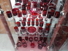 A quantity of ruby glass dishes and glasses