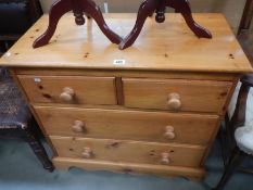 A modern solid pine chest of drawers