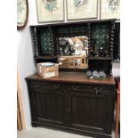 A 1930's oak dresser with leaded green bullseye top