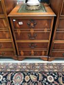 A leather topped walnut 2 drawer filing cabinet