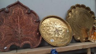 2 brass trays and 1 copper tray