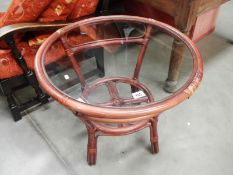 A glass top bamboo coffee table