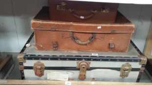 A vintage tin trunk and 2 vintage cases