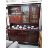 A dark wood stained mahogany bookcase wall unit