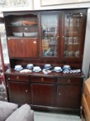 A dark wood stained mahogany bookcase wall unit