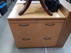 An oak 2 drawer filing cabinet