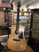 An Aria acoustic model AW100 guitar stand not included