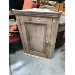 A pine corner cupboard