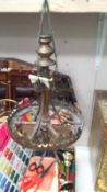 An old brass hanging lamp base