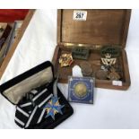 A box of military badges including World War 1 star etc.