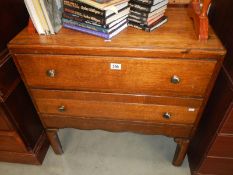 A 1930's oak bedroom chest of 2 drawers