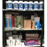 3 shelves of office stationary items including propelling pencils, screen cleaners etc.