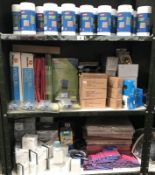 3 shelves of office stationary items including propelling pencils, screen cleaners etc.