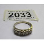 A 9ct gold 5 stone cubic zirconia eternity ring, size K half.
