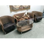 A conservatory wicker suite consisting of sofa,