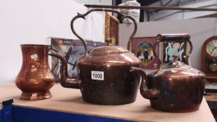 A Victoria copper kettle and smaller example and a copper tankard