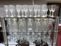 A large quantity of wine/champagne glasses