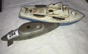 A Sutcliffe tinplate boat and a submarine