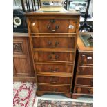 A leather topped walnut 3 drawer filing cabinet