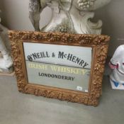 A gilt framed O'Neill's Irish Whisky mirror.