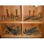 A quantity of brassware including horse brasses, candlesticks,