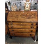 A late 19th Century / early 20th Century inlaid bureau featuring 4 drawers