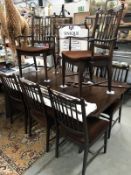 A mahogany dining table and 8 chairs