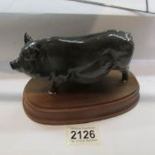 A pig on base (possibly Beswick but mark not visible).