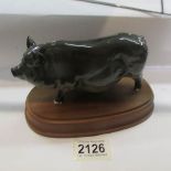 A pig on base (possibly Beswick but mark not visible).