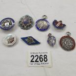 A mixed lot of silver badges and medallions.