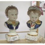 A pair of Staffordshire busts of a boy and girl.