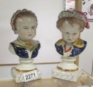 A pair of Staffordshire busts of a boy and girl.