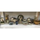 A quantity of motto ware pottery including jugs etc.