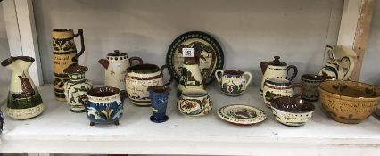 A quantity of motto ware pottery including jugs etc.