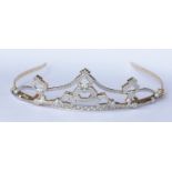 A diamond tiara set in 18ct gold contains Pave set round brilliant cut diamonds of fine quality.