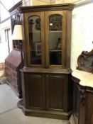 A corner display cabinet top with cupboard base