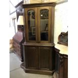 A corner display cabinet top with cupboard base