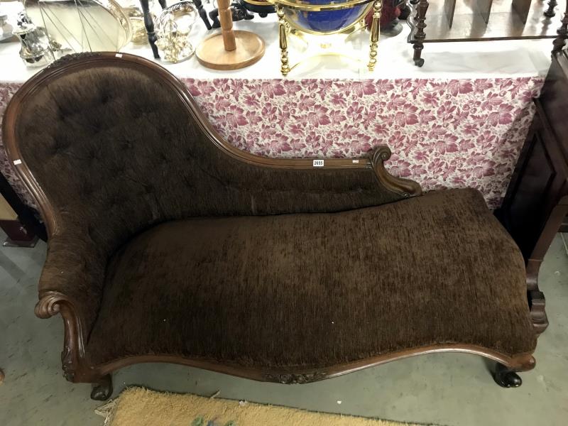 A Victorian mahogany framed chaise lounge
