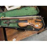 An old violin with 3 bows and wooden case.