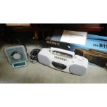 A boxed Sony CFS-B11L radio cassette recorder player and a CD player