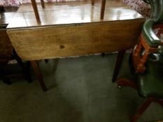 An oak Pembroke table.