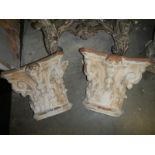 A pair of 19th century painted Terracotta Italina 'capitols'.