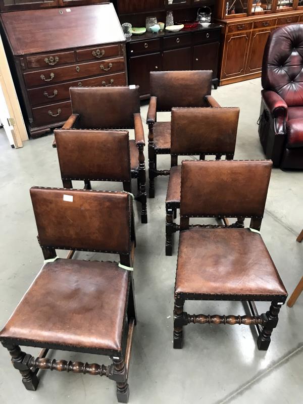 A set of 6 1930's oak chairs with leather seats,